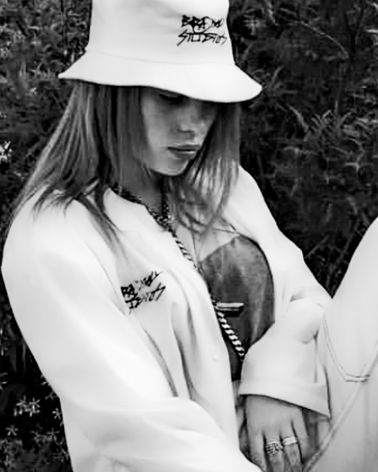 Billie Eilish in Brashy Studios bucket hat and jacket.
